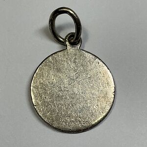 Authentic Tiffany and Co round pendant. Used initials GDH